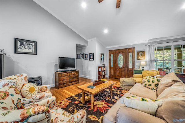 living room featuring light hardwood / wood-style flooring, ceiling fan, crown molding, and lofted ceiling