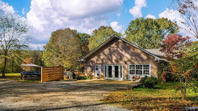 back of property featuring french doors