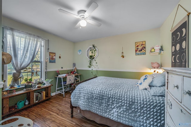 bedroom with ceiling fan and wood-type flooring