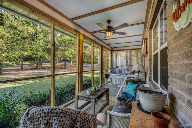 sunroom / solarium featuring ceiling fan