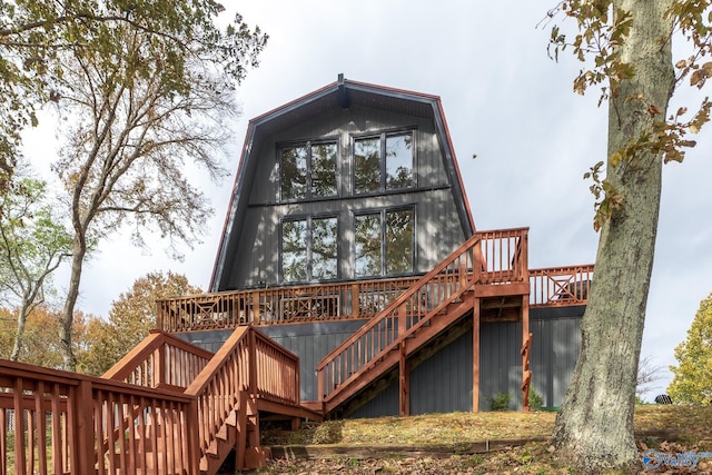 rear view of property with a wooden deck