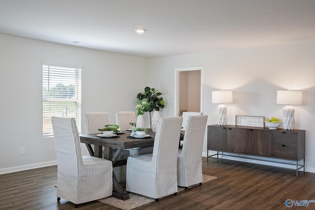 dining room with dark hardwood / wood-style floors