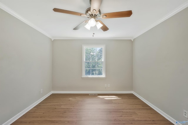 unfurnished room with ornamental molding, wood-type flooring, and ceiling fan