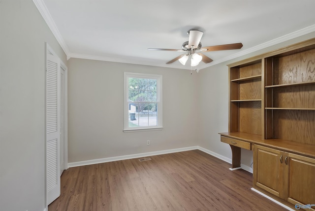 interior space with dark hardwood / wood-style flooring, crown molding, and ceiling fan