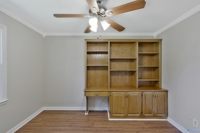 unfurnished office with crown molding, ceiling fan, and light hardwood / wood-style flooring