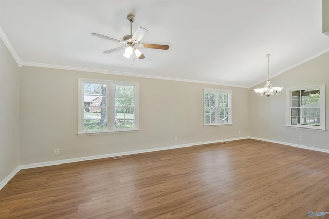 spare room with wood-type flooring, vaulted ceiling, ceiling fan with notable chandelier, and crown molding