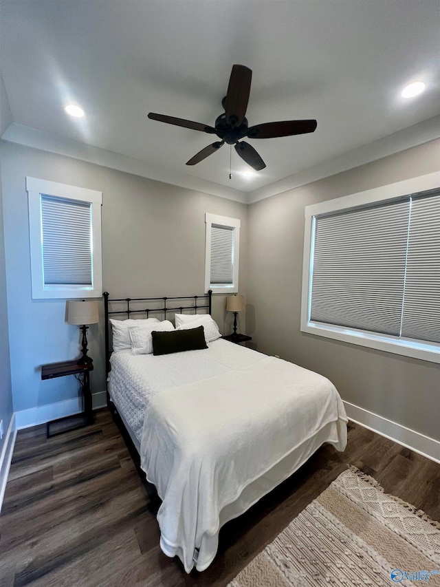 bedroom featuring ceiling fan and dark wood-type flooring