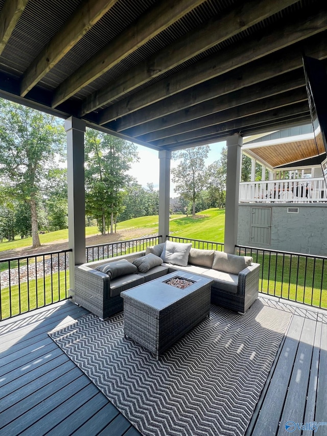 wooden deck featuring a lawn and an outdoor living space