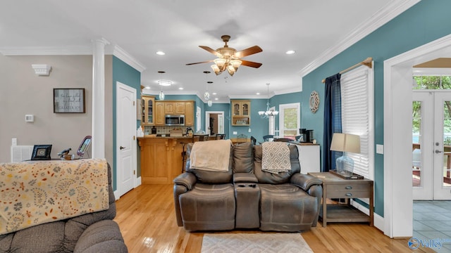 44 Jeff St, Scottsboro, AL 35769 - living area featuring a chandelier, a ceiling fan, recessed lighting, light wood-style floors, and crown molding