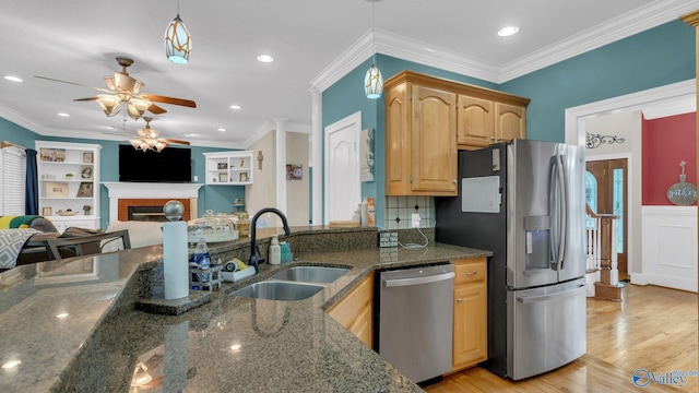 44 Jeff St, Scottsboro, AL 35769 - kitchen with appliances with stainless steel finishes, ceiling fan, open floor plan, a fireplace, and dark stone counters
