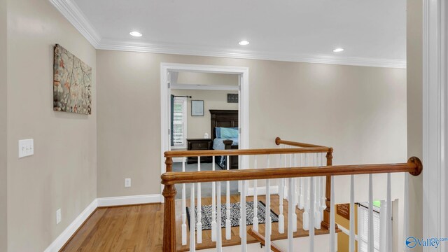 44 Jeff St, Scottsboro, AL 35769 - hallway with crown molding, wood finished floors, recessed lighting, and an upstairs landing