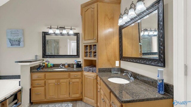 44 Jeff St, Scottsboro, AL 35769 - bathroom featuring two vanities and a bathtub