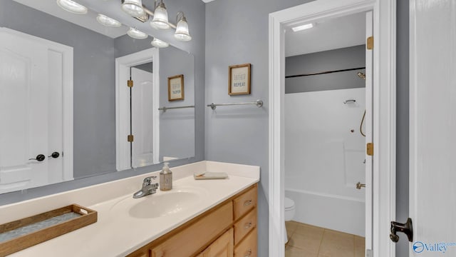 44 Jeff St, Scottsboro, AL 35769 - full bath with vanity, tile patterned floors, and tub / shower combination