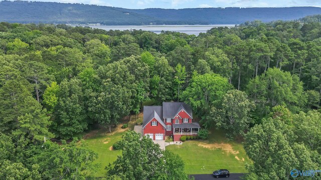 44 Jeff St, Scottsboro, AL 35769 - aerial view of property and surrounding area with a heavily wooded area and a large body of water