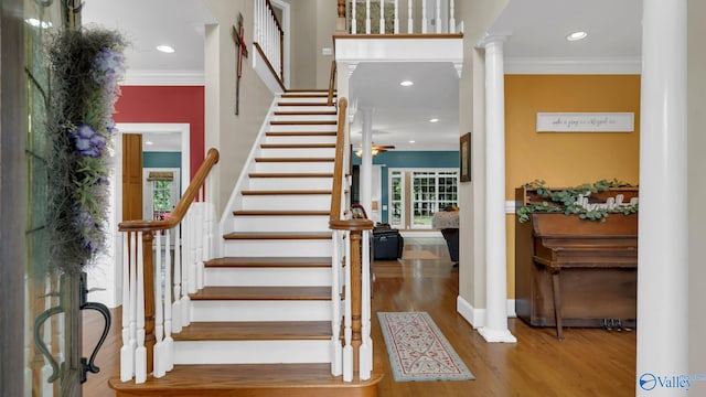 44 Jeff St, Scottsboro, AL 35769 - stairway featuring crown molding, wood finished floors, decorative columns, recessed lighting, and ceiling fan