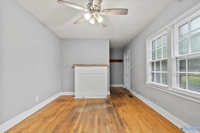 1617 7th St SE, Decatur, AL 35601 - unfurnished room featuring baseboards, wood-type flooring, and a ceiling fan