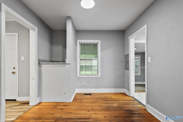 1617 7th St SE, Decatur, AL 35601 - unfurnished room with wood finished floors, electric panel, and baseboards