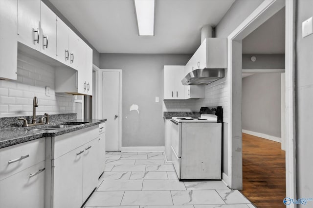 1617 7th St SE, Decatur, AL 35601 - kitchen featuring white electric range, a sink, light marble finish flooring, baseboards, and white cabinets