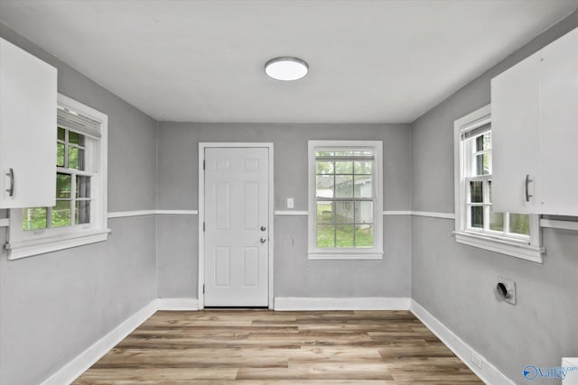 1617 7th St SE, Decatur, AL 35601 - entryway with healthy amount of natural light, wood finished floors, and baseboards