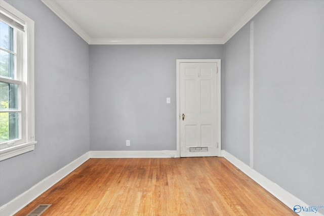 1617 7th St SE, Decatur, AL 35601 - spare room featuring wood finished floors, ornamental molding, and baseboards
