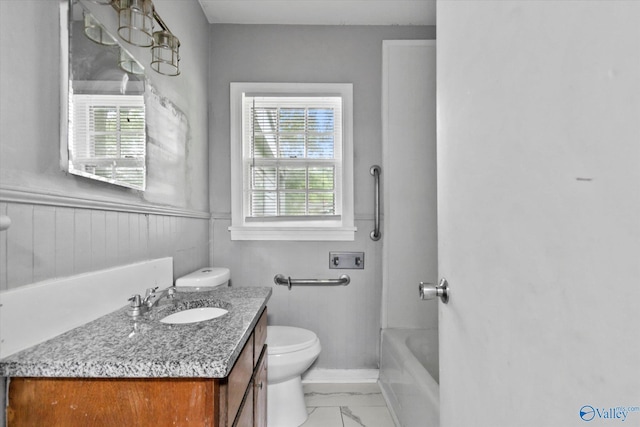 1617 7th St SE, Decatur, AL 35601 - full bathroom featuring toilet, vanity, healthy amount of natural light, marble finish flooring, and wainscoting