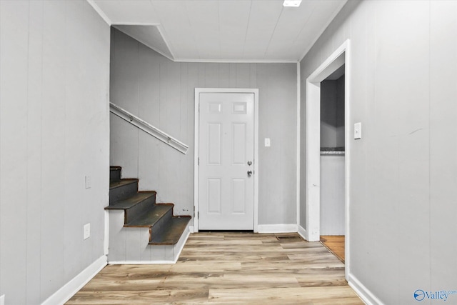 1617 7th St SE, Decatur, AL 35601 - entrance foyer with light wood-type flooring, crown molding, stairway, and baseboards