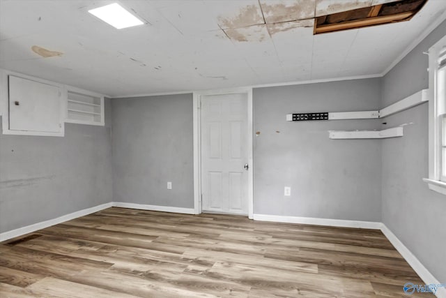 1617 7th St SE, Decatur, AL 35601 - finished basement featuring wood finished floors, baseboards, and ornamental molding