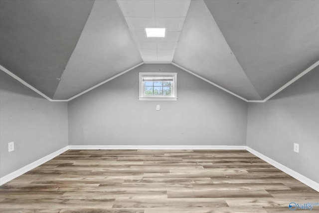 1617 7th St SE, Decatur, AL 35601 - bonus room featuring wood finished floors, baseboards, and vaulted ceiling