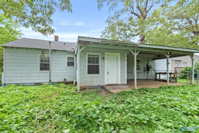 1617 7th St SE, Decatur, AL 35601 - rear view of property with a chimney, a shingled roof, and a patio area