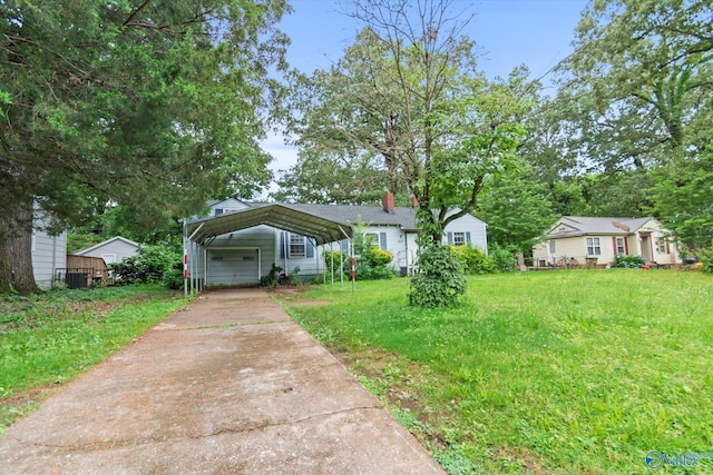 1617 7th St SE, Decatur, AL 35601 - view of front of house featuring a detached carport, a front yard, driveway, and a chimney
