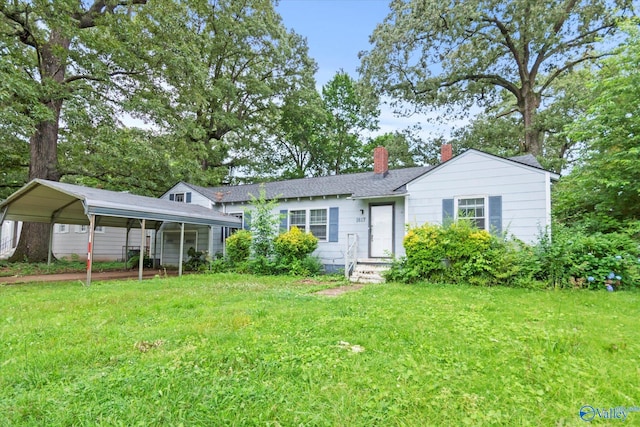 1617 7th St SE, Decatur, AL 35601 - view of front of house featuring a chimney, a front lawn, and a carport
