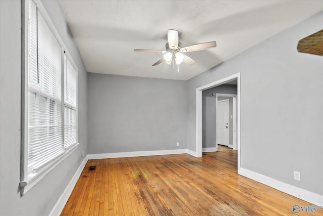 1617 7th St SE, Decatur, AL 35601 - empty room with a ceiling fan, baseboards, and wood-type flooring