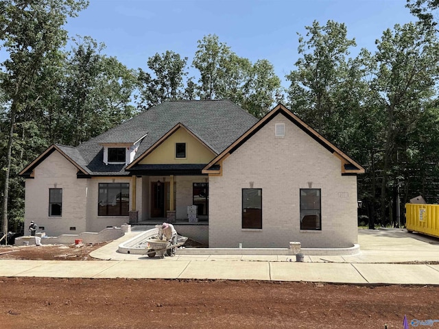 55 Trail Loop Rd, Huntsville, AL 35803 - view of front of home with brick siding, a porch, and roof with shingles