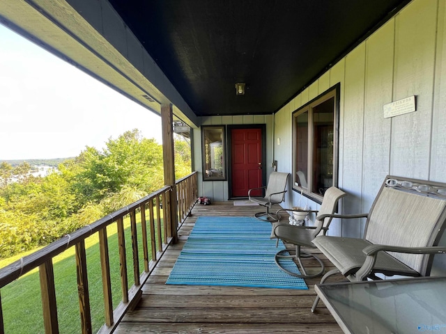 wooden deck with a yard