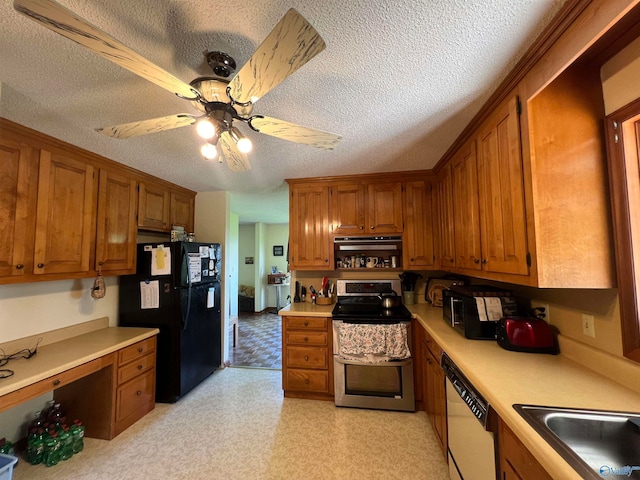 kitchen featuring a textured ceiling, white dishwasher, ceiling fan, stainless steel range with electric cooktop, and black fridge