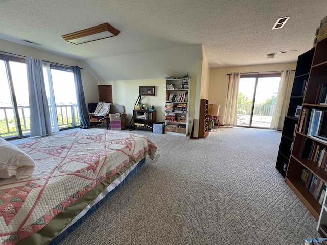 carpeted bedroom featuring access to outside, a textured ceiling, and lofted ceiling