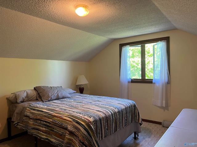 bedroom featuring carpet flooring, a textured ceiling, and vaulted ceiling