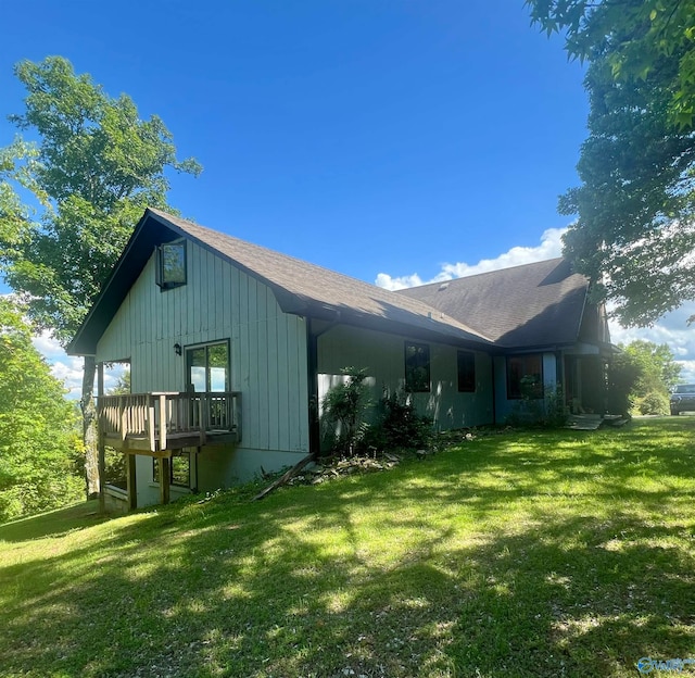 view of side of home featuring a yard