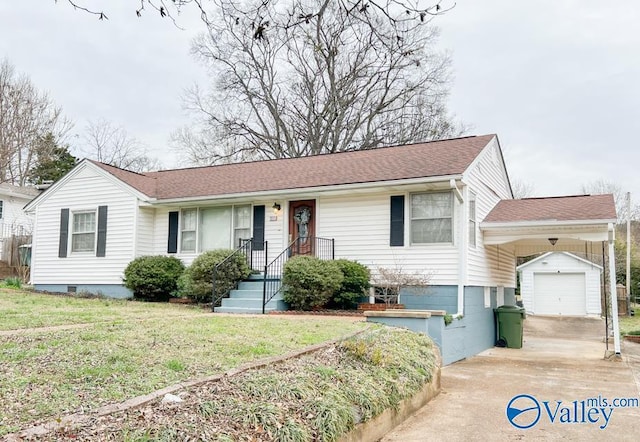 ranch-style house with an outbuilding, concrete driveway, crawl space, and a front yard