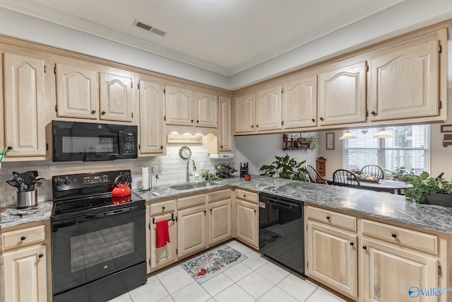 kitchen with light tile patterned flooring, sink, ornamental molding, and black appliances