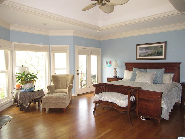 bedroom featuring ceiling fan, wood-type flooring, multiple windows, and access to outside