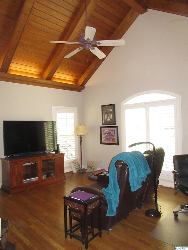 living room featuring dark hardwood / wood-style flooring, wooden ceiling, ceiling fan, and vaulted ceiling with beams