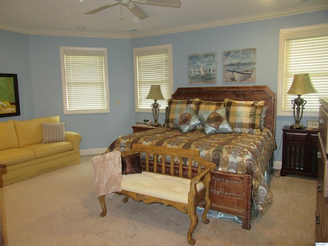 carpeted bedroom featuring crown molding and ceiling fan