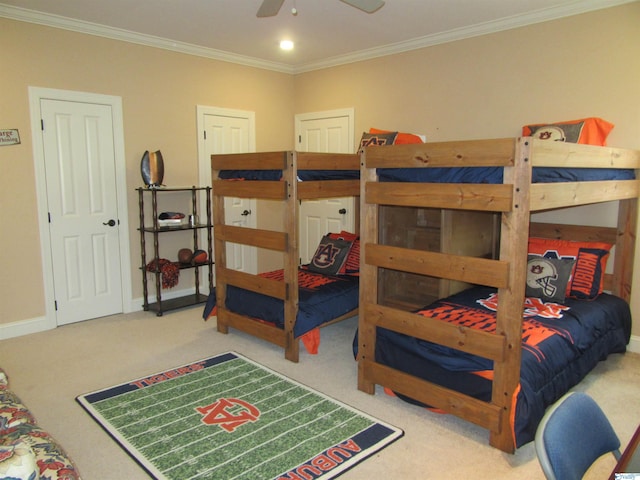 bedroom featuring crown molding, light colored carpet, and ceiling fan