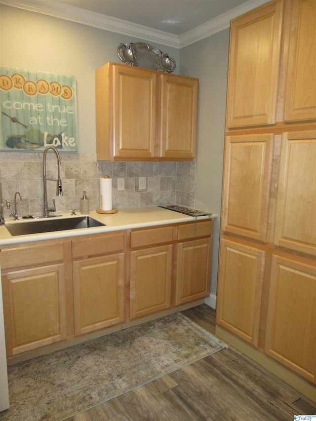 kitchen with crown molding, tasteful backsplash, dark hardwood / wood-style floors, light brown cabinetry, and sink