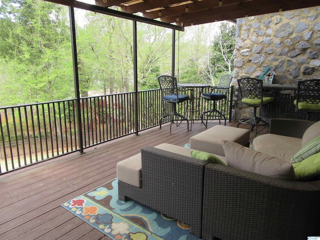 wooden deck featuring outdoor lounge area