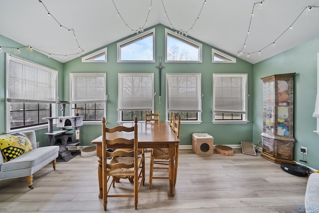 sunroom featuring vaulted ceiling