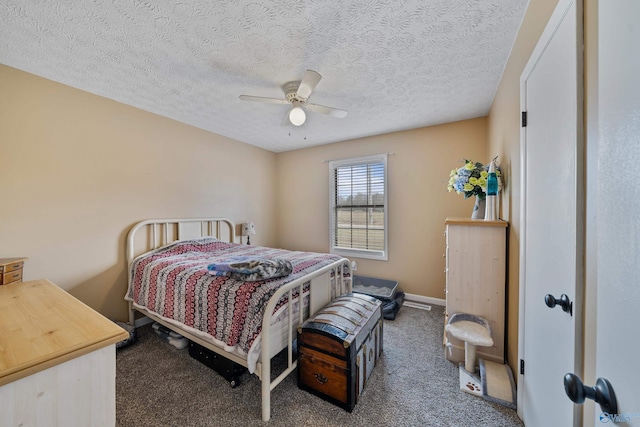 bedroom with carpet flooring, a textured ceiling, and ceiling fan