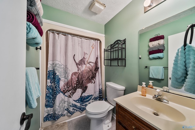 bathroom featuring vanity, tile patterned floors, a shower with shower curtain, toilet, and a textured ceiling