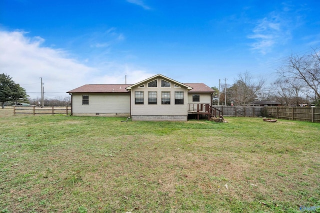 back of house with a yard